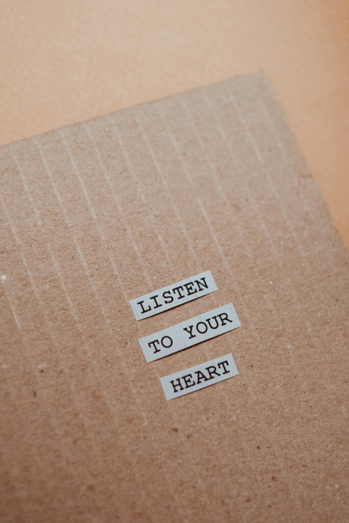 A cardboard piece featuring the motivational quote 'Listen to your heart'. Perfect for inspiration.